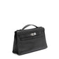 Hermès Kelly Pochette in black swift leather, compact handbag with gold hardware, elegant and luxurious design.