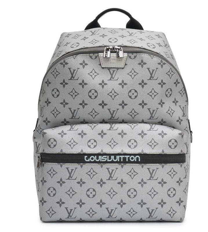 Louis Vuitton Kim Jones Apollo Monogram Reflect Backpack from Spring/Summer 2018 in grey reflective Monogram canvas with black trim, top handle and front zip pocket.
