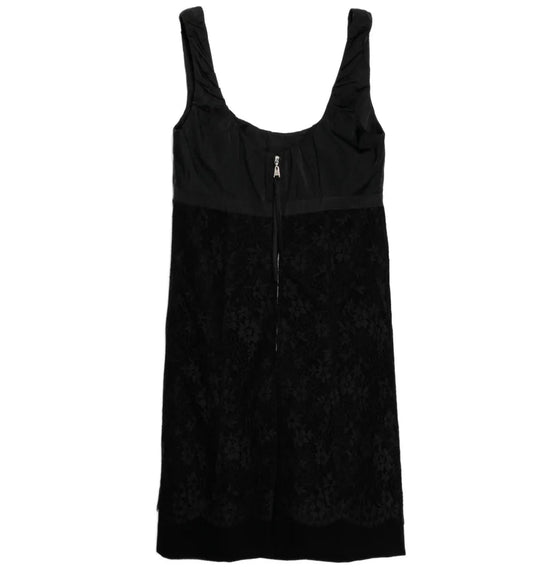 Louis Vuitton lace corset dress with intricate lace details and fitted silhouette, shown from a side view.