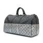 Louis Vuitton Eclipse Monogram Keepall Bandoulière 50 in grey and black Monogram canvas with rolled top handles, zip-top silver and oversized Louis Vuitton logo detail.