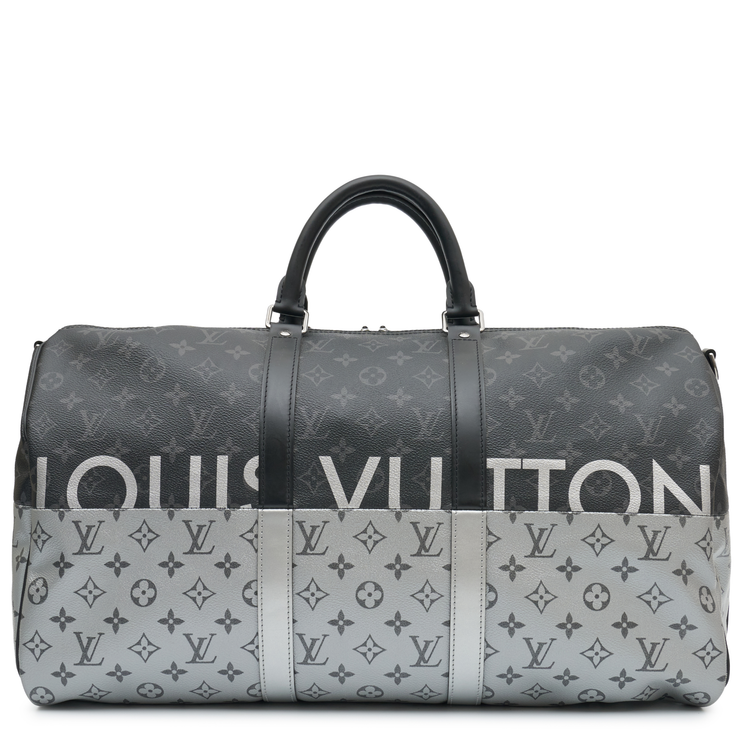 Louis Vuitton Eclipse Monogram Keepall Bandoulière 50 in grey and black Monogram canvas with rolled top handles, zip-top silver and oversized Louis Vuitton logo detail.