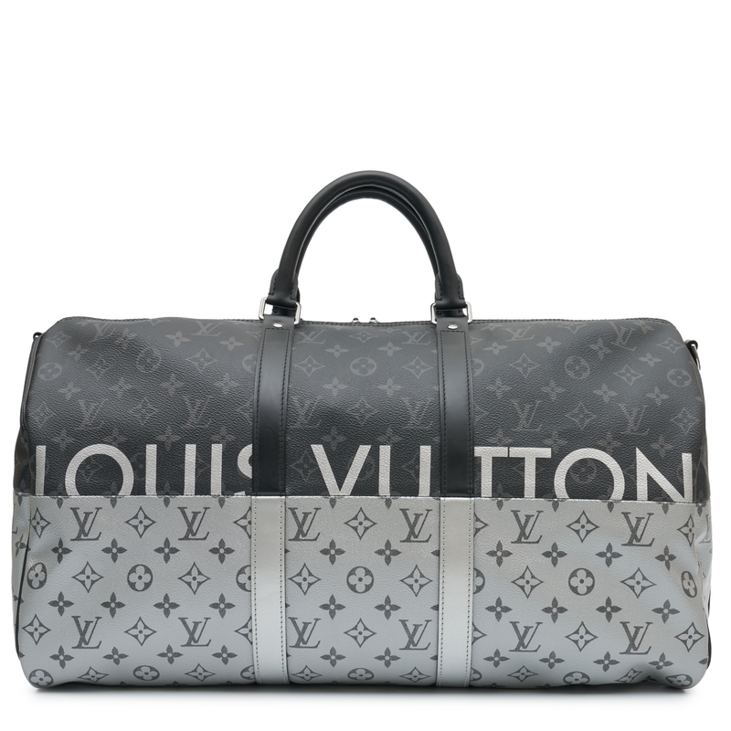 Louis Vuitton Eclipse Monogram Keepall Bandoulière 50 in grey and black Monogram canvas with rolled top handles, zip-top silver and oversized Louis Vuitton logo detail.
