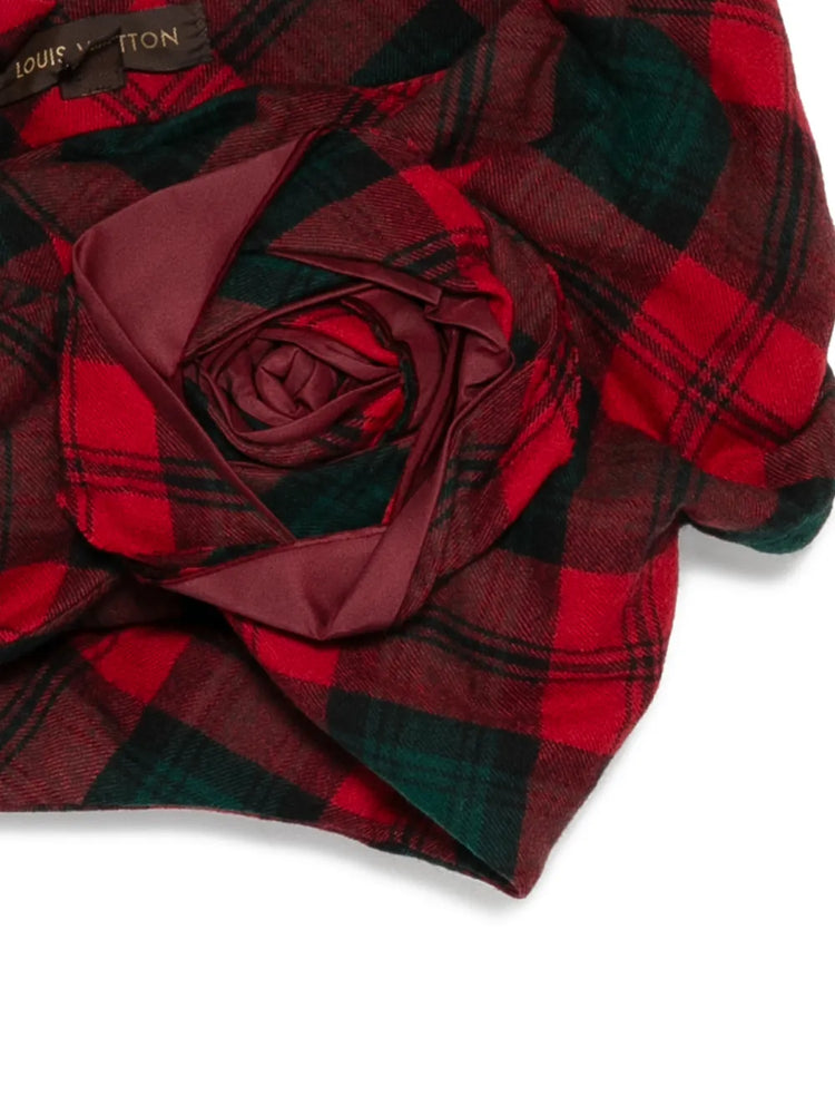 Louis Vuitton Fall 2004 tartan mini cape with oversized rosette in red, burgundy and deep green plaid, shown as a Marc Jacobs runway piece.