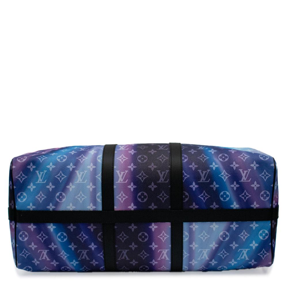 Louis Vuitton Keepall Bandoulière 50 Sunset travel bag with leather trim and spacious interior, stylish for weekend trips.