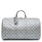 Louis Vuitton Metallic Monogram Keepall Bandoulière 50 in silver Monogram canvas with rolled top handles, silver-tone hardware, top zip closure and matching luggage tag.
