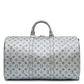 Louis Vuitton Metallic Monogram Keepall Bandoulière 50 in silver Monogram canvas with rolled top handles, silver-tone hardware, top zip closure and matching luggage tag.