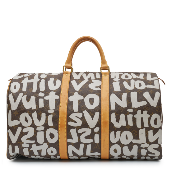 Louis Vuitton x Stephen Sprouse Graffiti Keepall 50 in brown Monogram canvas with oversized white graffiti lettering, Vachetta leather handles and gold-tone hardware.