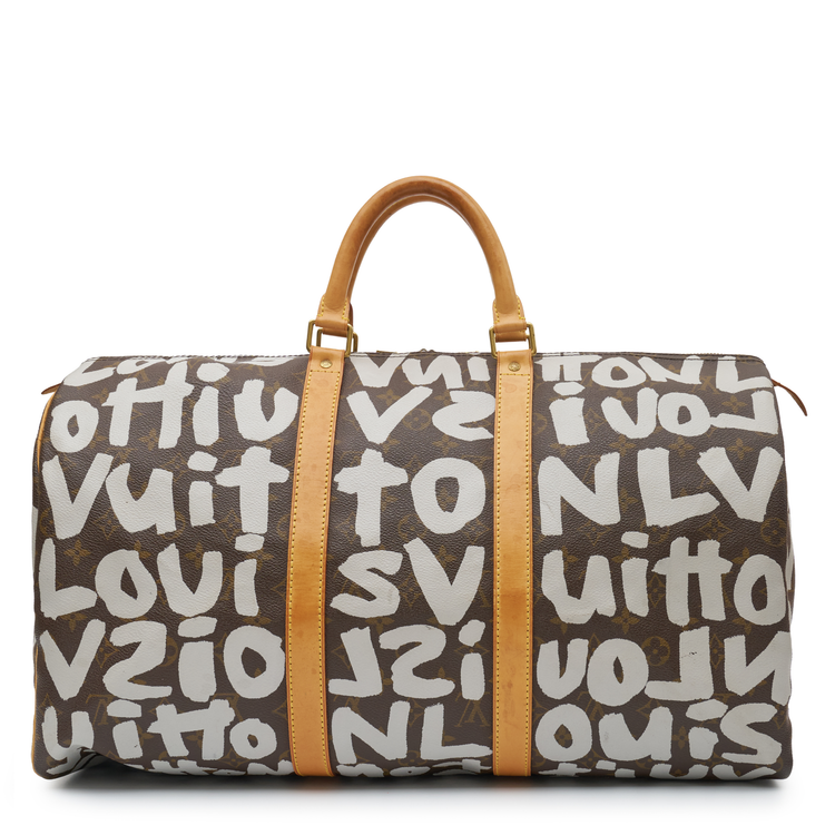 Louis Vuitton x Stephen Sprouse Graffiti Keepall 50 in brown Monogram canvas with oversized white graffiti lettering, Vachetta leather handles and gold-tone hardware.