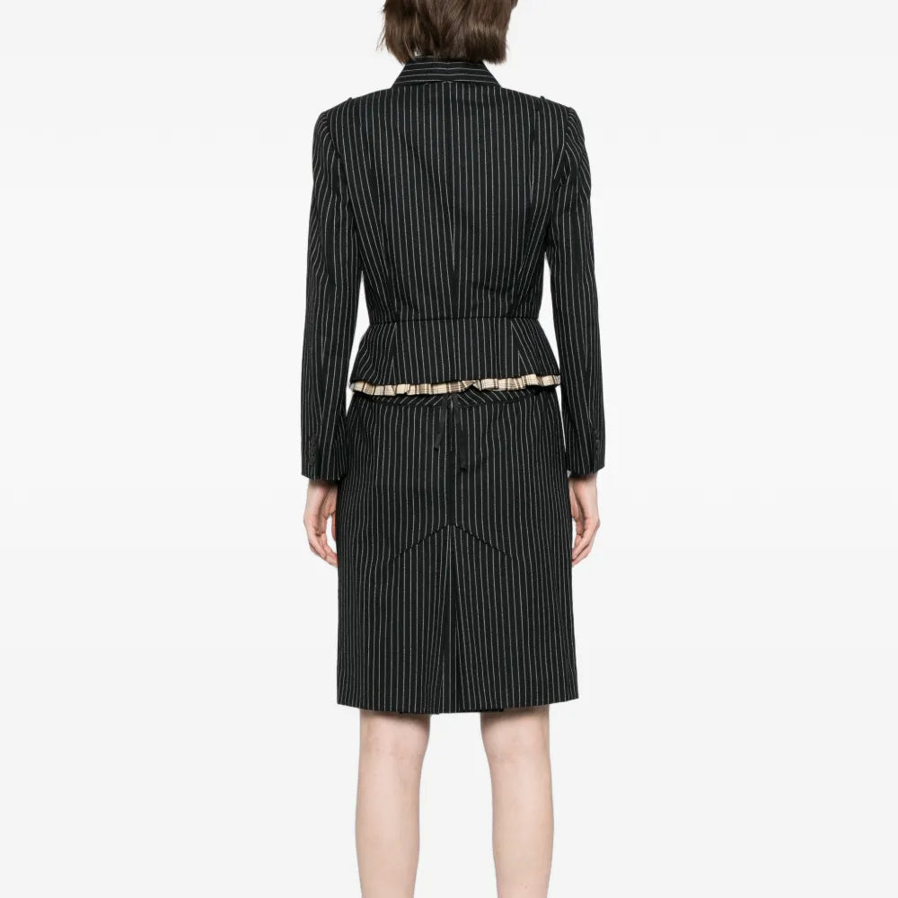 Louis Vuitton striped skirt suit set with blazer and matching skirt, shown from the back on a model.