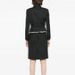 Louis Vuitton striped skirt suit set with blazer and matching skirt, shown from the back on a model.