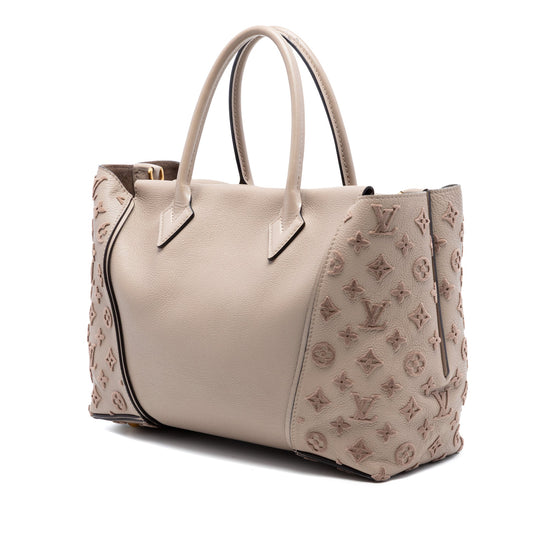 Louis Vuitton Veau Cachemire Tote PM handbag in beige grained leather with tonal Monogram embroidered side panels, double top handles and gold-tone hardware.