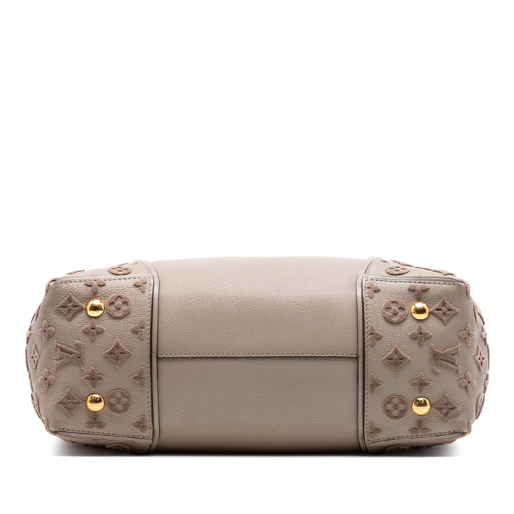 Louis Vuitton Veau Cachemire Tote PM handbag in soft leather with subtle stitching, featuring dual top handles and spacious interior.