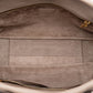 Louis Vuitton Veau Cachemire Tote PM handbag in soft leather with sleek design and subtle branding, displayed against a neutral background.