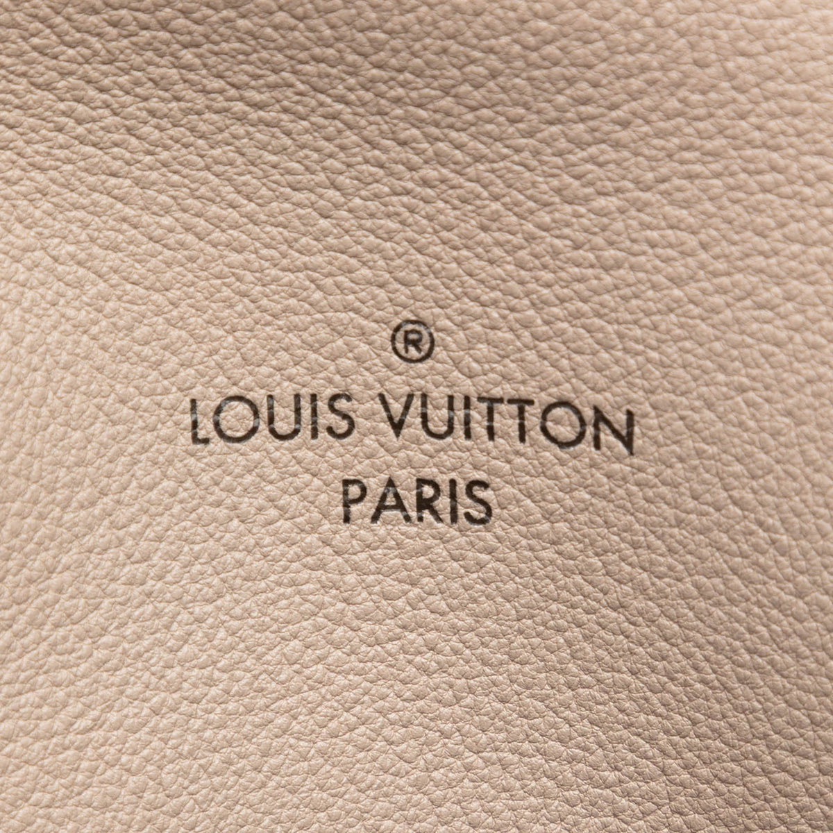 Louis Vuitton Veau Cachemire Tote PM handbag in soft beige leather with gold-tone hardware and spacious interior.