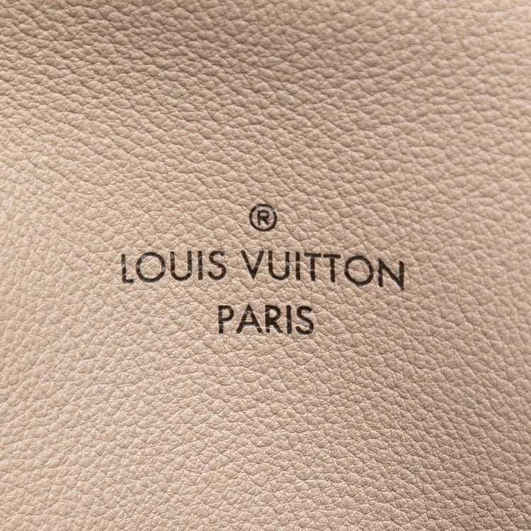 Louis Vuitton Veau Cachemire Tote PM handbag in soft beige leather with gold-tone hardware and spacious interior.
