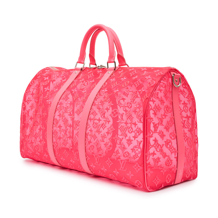 Louis Vuitton Virgil Abloh pink mesh Keepall Bandouliere 50 travel bag with adjustable strap and spacious interior.