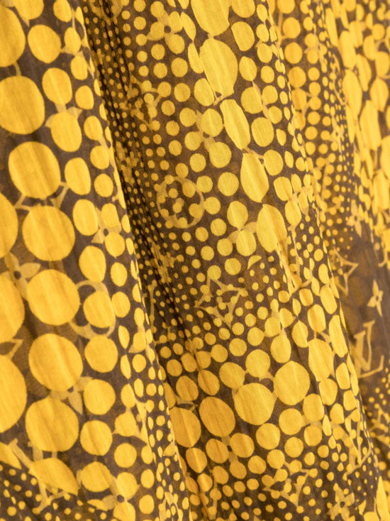 Louis Vuitton x Yayoi Kusama scarf in mustard yellow and brown with all-over polka dot artwork, Monogram motifs, blue Louis Vuitton signature and frayed edges.