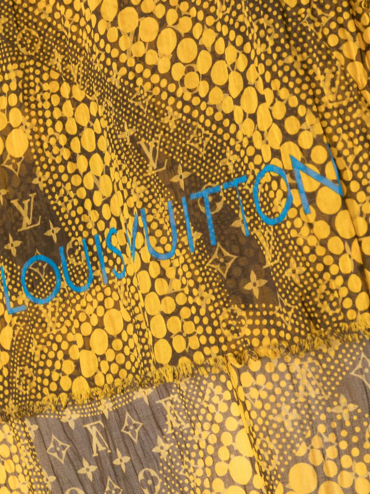 Louis Vuitton x Yayoi Kusama scarf in mustard yellow and brown with all-over polka dot artwork, Monogram motifs, blue Louis Vuitton signature and frayed edges.