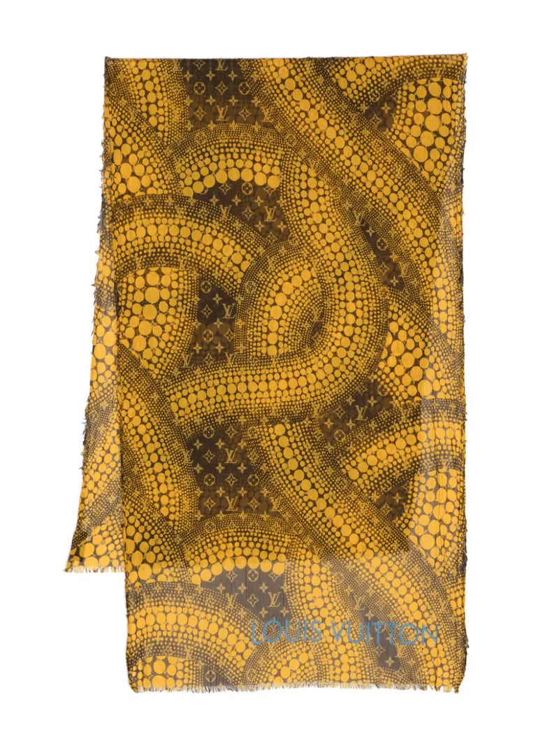 Louis Vuitton x Yayoi Kusama scarf in mustard yellow and brown with all-over polka dot artwork, Monogram motifs, blue Louis Vuitton signature and frayed edges.