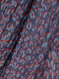 Louis Vuitton cheetah print scarf with bold animal pattern and luxurious fabric, styled for elegant fashion statements.