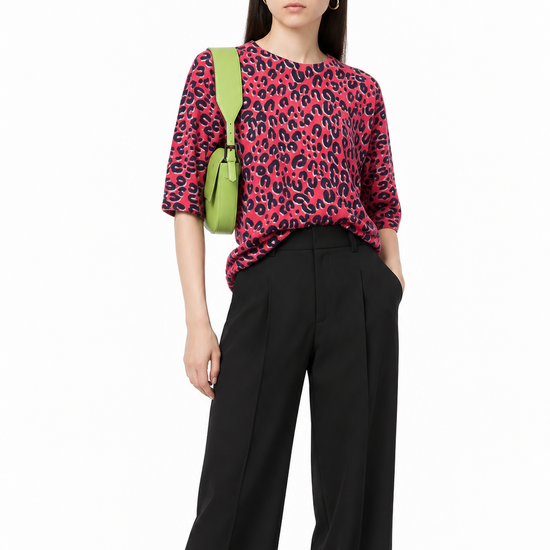 Louis Vuitton x Stephen Sprouse 2006 leopard print jumper in red, pink and black with round neckline, elbow-length sleeves and relaxed longline fit.