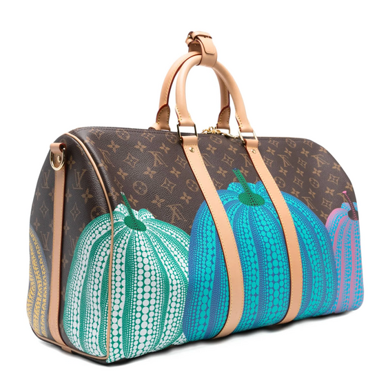 Louis Vuitton LV x Yayoi Kusama Monogram Pumpkins Keepall Bandoulière 45 travel bag with vibrant pumpkin print and Monogram canvas.