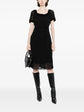 Pre-owned MARC JACOBS VINTAGE boat neck crepe dress displayed on a hanger, showcasing the classic neckline and elegant fabric.