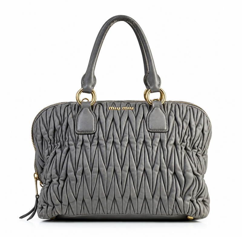 Miu Miu Matelassé tote bag with quilted design, front view showing rich texture and elegant style.