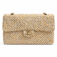 Chanel medium gold tweed shoulder bag with a single flap and gold-tone hardware, stylish and elegant accessory.