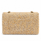 Chanel medium gold tweed shoulder bag with a single flap and chain strap, showcasing elegant texture and classic design.