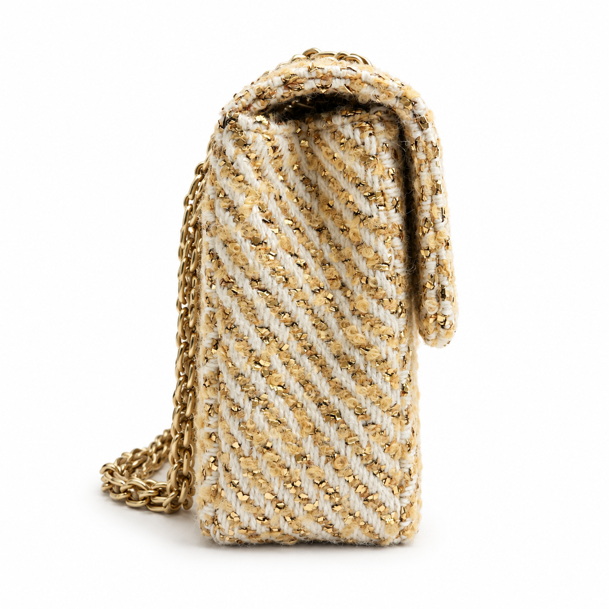 Chanel medium gold tweed shoulder bag with a single flap and chain strap, showcasing elegant craftsmanship and textured fabric.