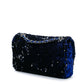 Chanel medium sequin shoulder bag with single flap and chain strap, sparkling sequins on black fabric for elegant style.
