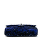Chanel medium sequin shoulder bag with single flap and chain strap, sparkling sequins on black fabric for elegant style.
