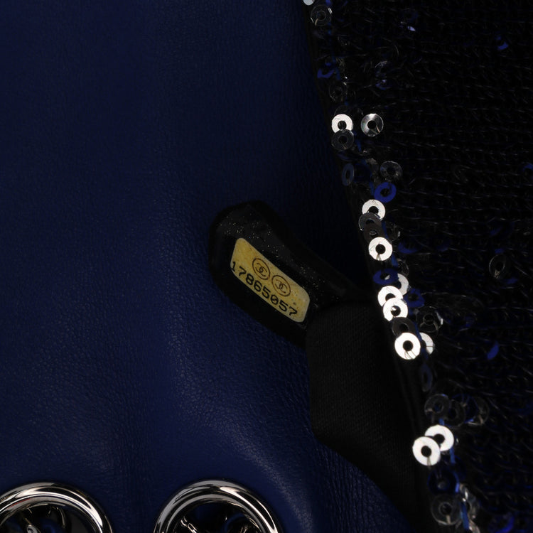 Chanel medium sequin shoulder bag with single flap and chain strap, featuring shimmering sequin embellishments.