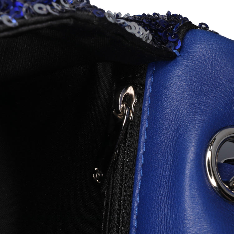 Chanel medium sequin shoulder bag with single flap, shiny sequin embellishments, and elegant design.