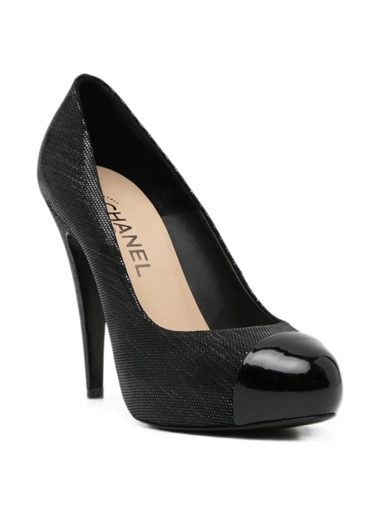 Chanel metallic pumps shoes with shiny silver finish, pointed toes, and sleek design, displayed on a neutral background.