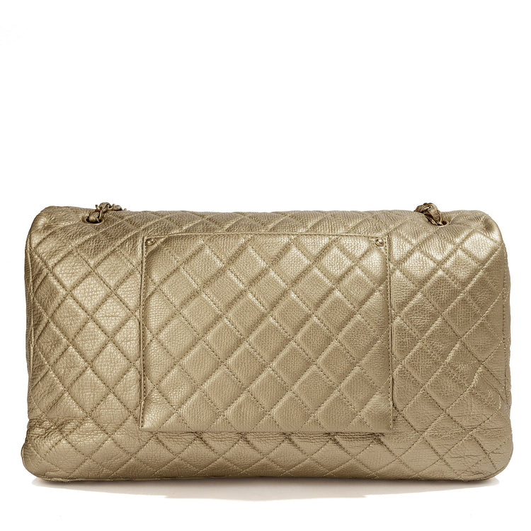 Metallic gold Chanel XXL airline travel flap bag with shoulder strap, featuring sleek design and luxurious finish.