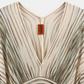 Missoni beige striped knit kaftan mini dress with deep V-neckline, batwing sleeves, fitted waistband, gathered front detail, self-tie back belt, and pale blue and brown stripe pattern.