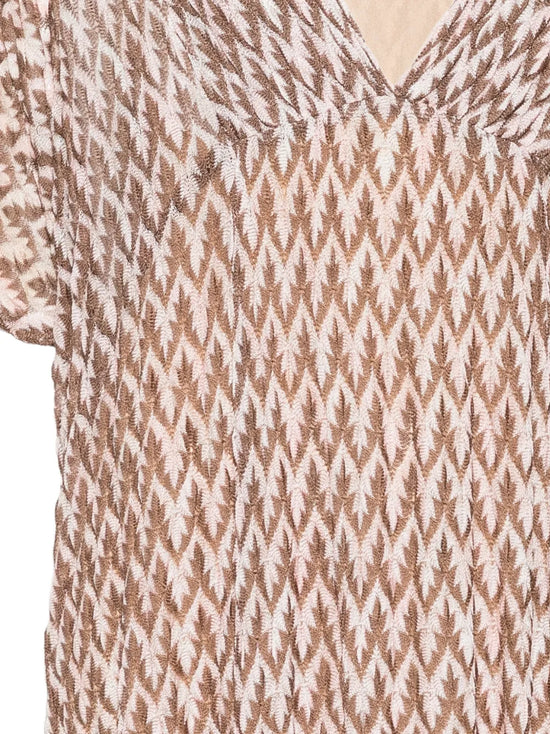 Missoni zigzag beach dress with colorful woven pattern, sleeveless design, and flowing fabric perfect for summer beach outings.