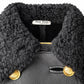 Black leather coat with shearling trim from Miu Miu, featuring a collar and stylish, warm design.