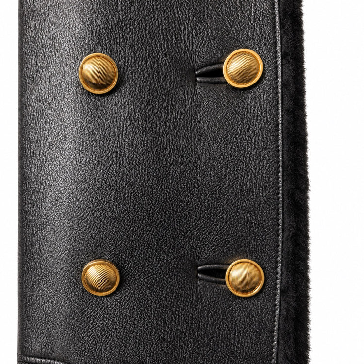 Black leather coat with shearling trim by Miu Miu, featuring a stylish collar and tailored fit, displayed on a hanger.