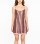 Miu Miu leopard print dress worn by a model, showcasing stylish pattern and elegant design for fashion-forward looks.