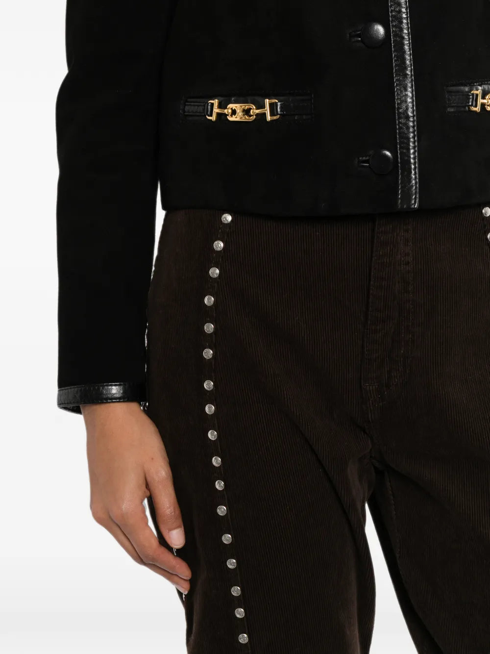 Close-up of Celine suede cropped jacket, showing soft texture and detailed stitching on a stylish blazer or jacket.