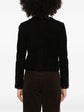Celine suede cropped jacket displayed on a hanger, showcasing its stylish design and textured material.