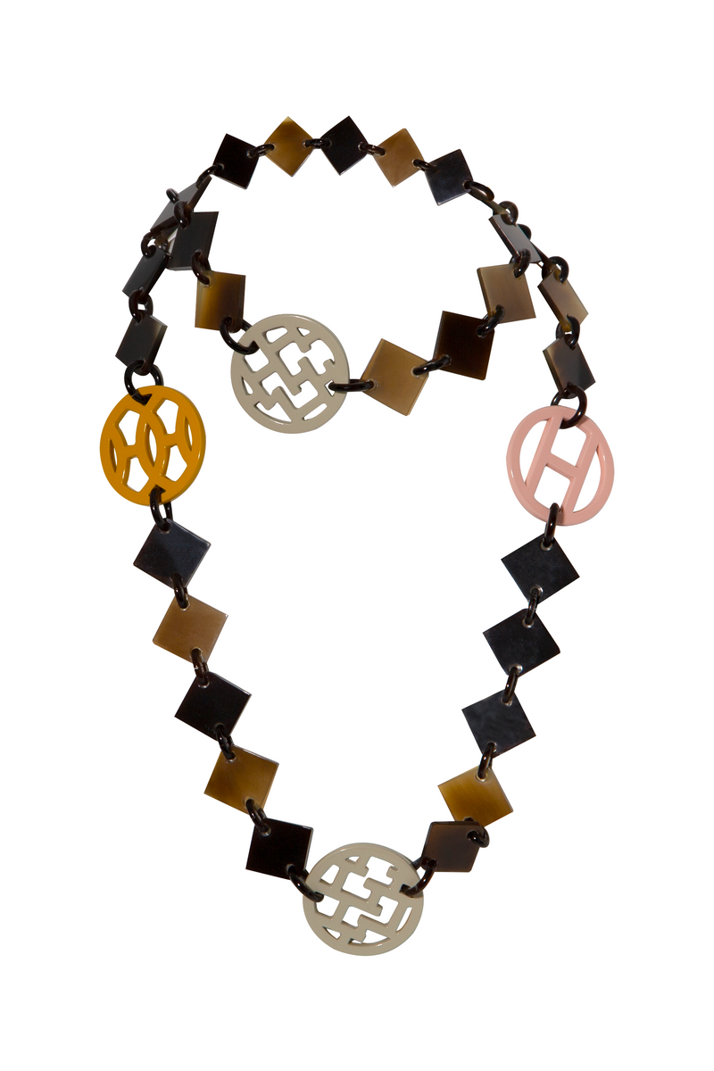 Hermès Pastel and multicolour lacquer Lena necklace with vibrant, layered beads and gold accents, styled on a white background.
