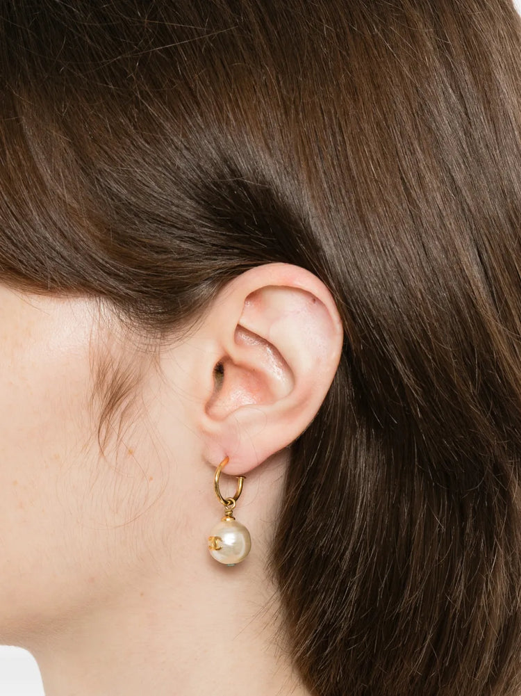 Pair of Chanel gold-tone hoop drop earrings featuring round cream faux pearls embellished with a small gold CC logo accent.