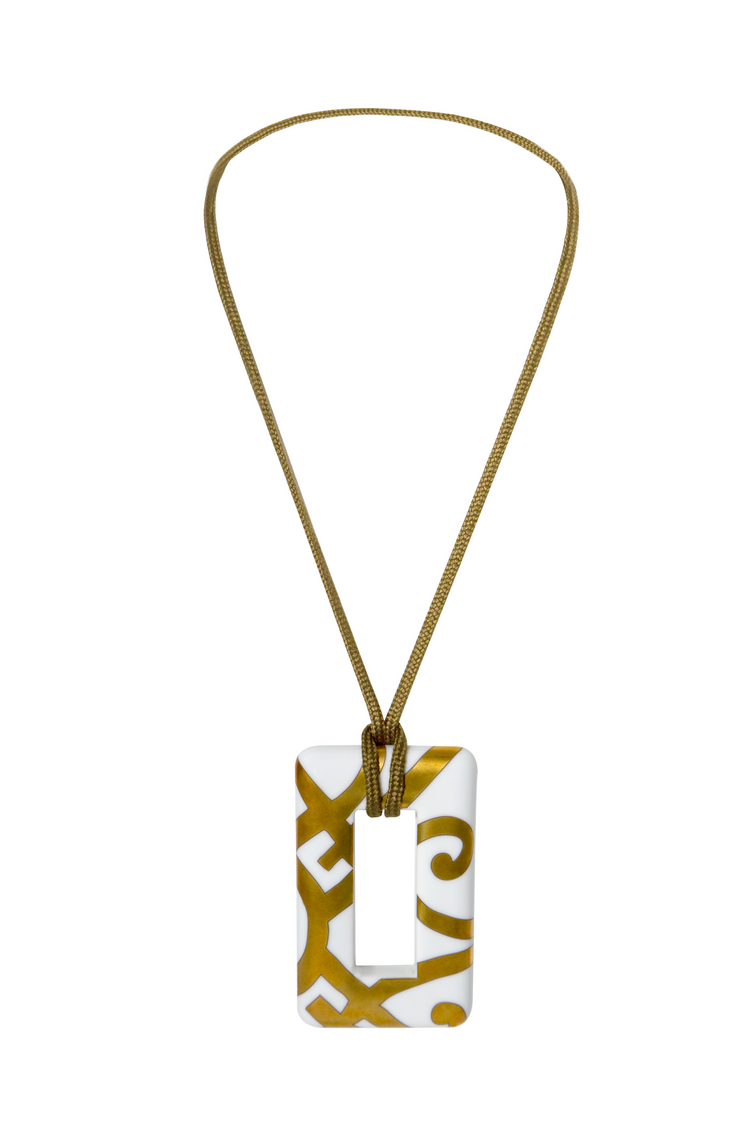 Hermès porcelain pendant necklace featuring a sleek, elegant design with a smooth, white porcelain pendant on a delicate chain.