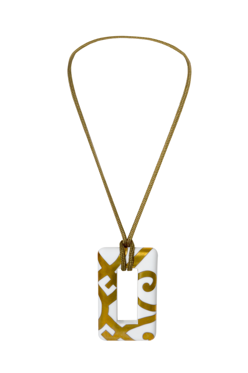 Hermès porcelain pendant necklace featuring a sleek, elegant design with a smooth, white porcelain pendant on a delicate chain.