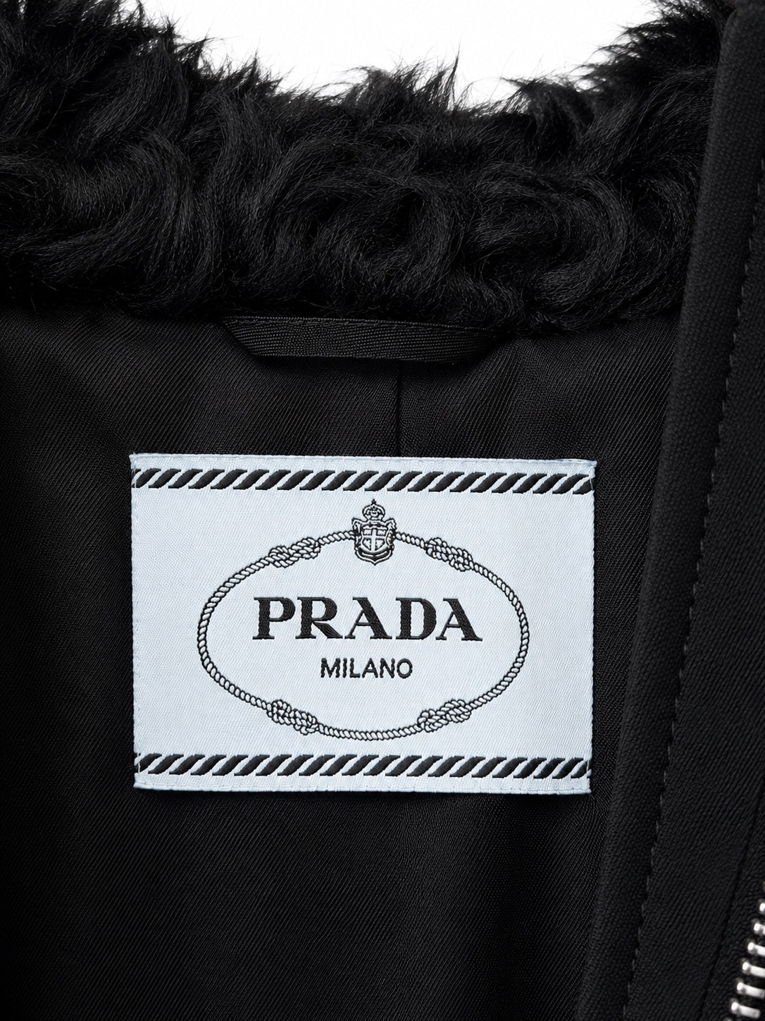 Black Prada cropped teddy jacket with label detail, stylish blazer with soft textured fabric and tailored fit.
