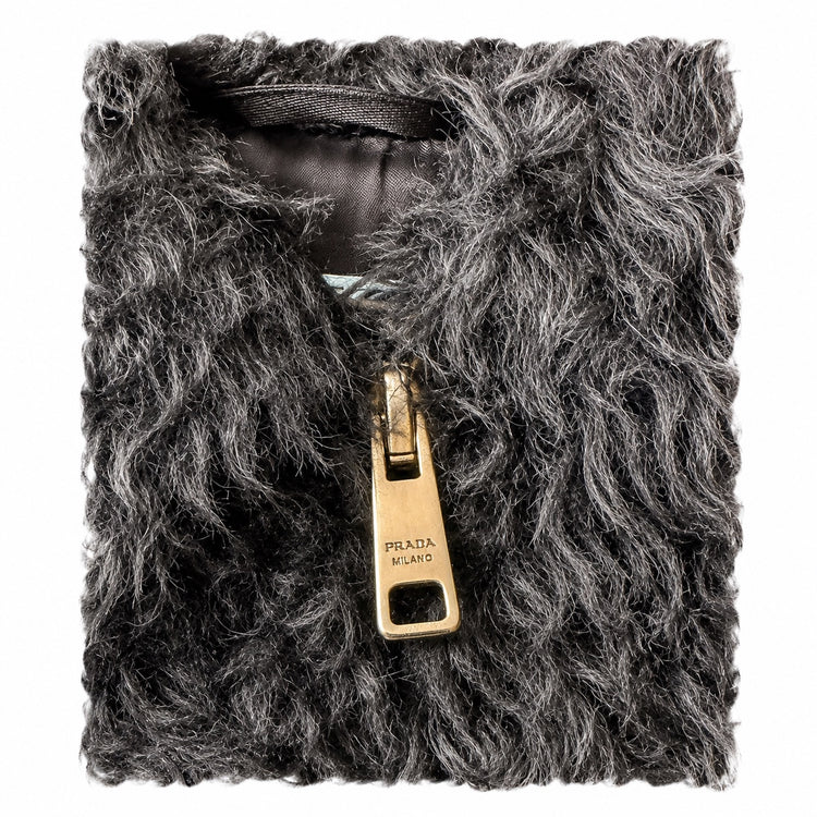 Black Prada cropped teddy jacket with zip closure, stylish blazer-inspired outerwear, soft textured fabric, and modern design.
